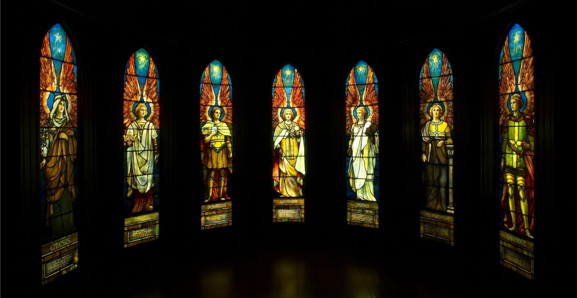 Angels in a semi[circle of stained glass windows