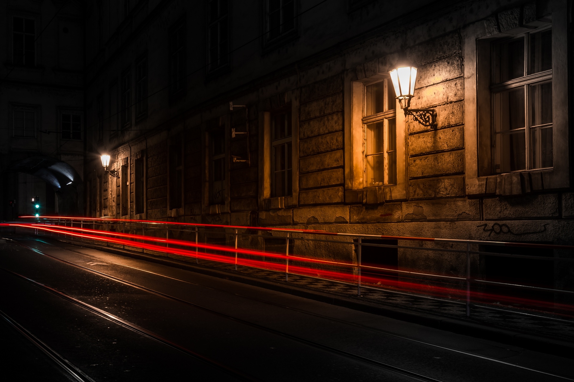 Long exposure shot of the illuminated cobbled street