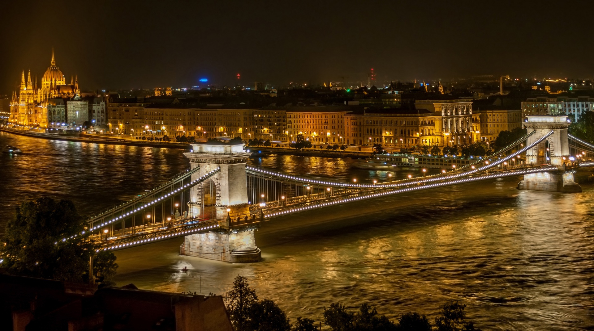 Night view of the Széchenyi Chain Bridge spanning the Danube River in Budapest, Hungary