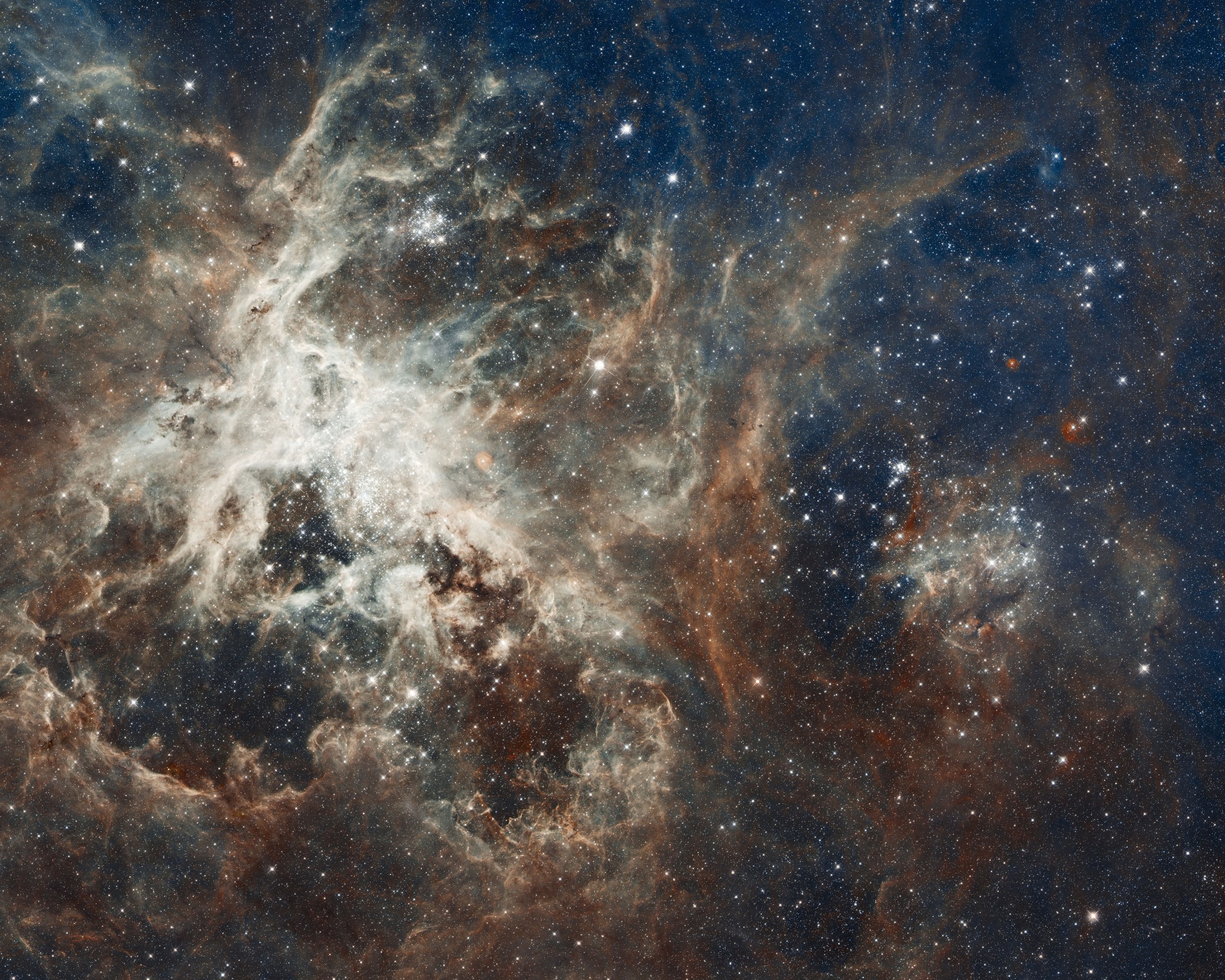 A photo of 30 Doradus, which is the brightest star-forming region visible in a neighboring galaxy and home to the most massive stars ever seen. Slightly left of center is a woman in white, with four arms, lying down, flinging a star into space.