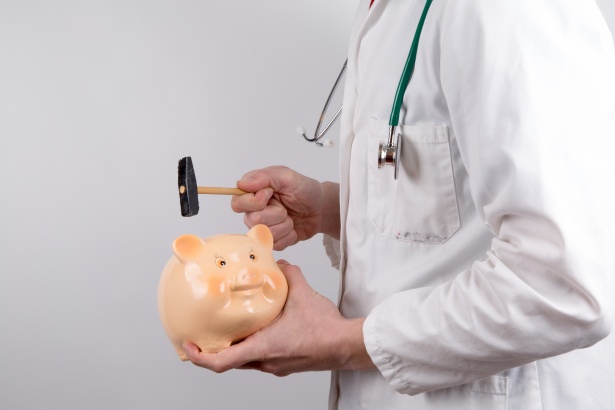 Doctor With Money-box Free Stock Photo - Public Domain Pictures