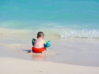 Little Boy Playing On Beach