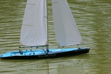 Model Yacht Sailing On Pond