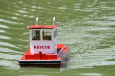 Red & White Rescue Craft In Pond