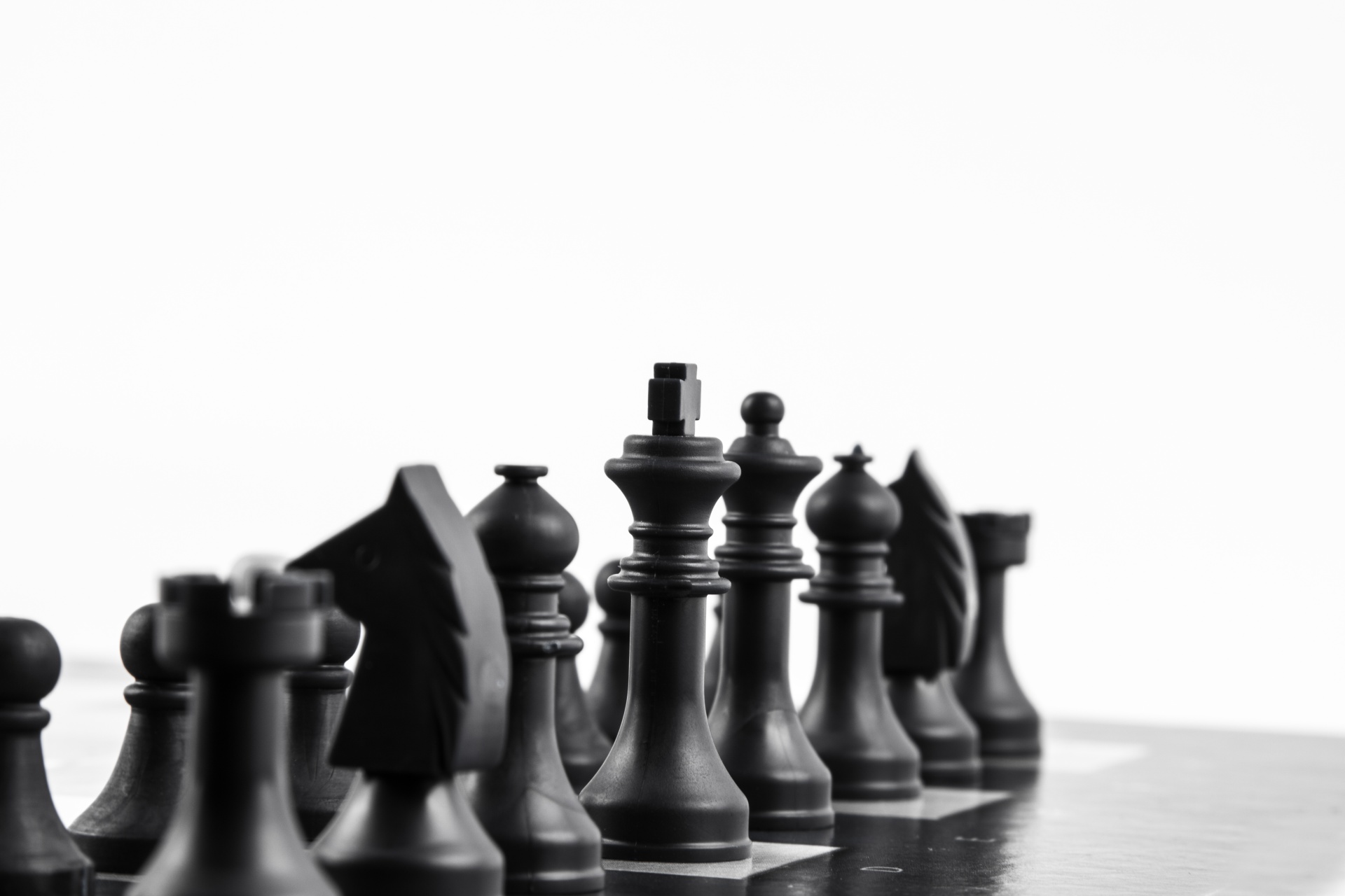 Chess pieces on the white background