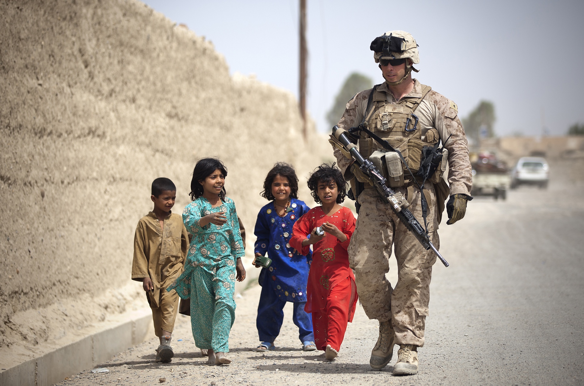 Children Following Marine On Patrol