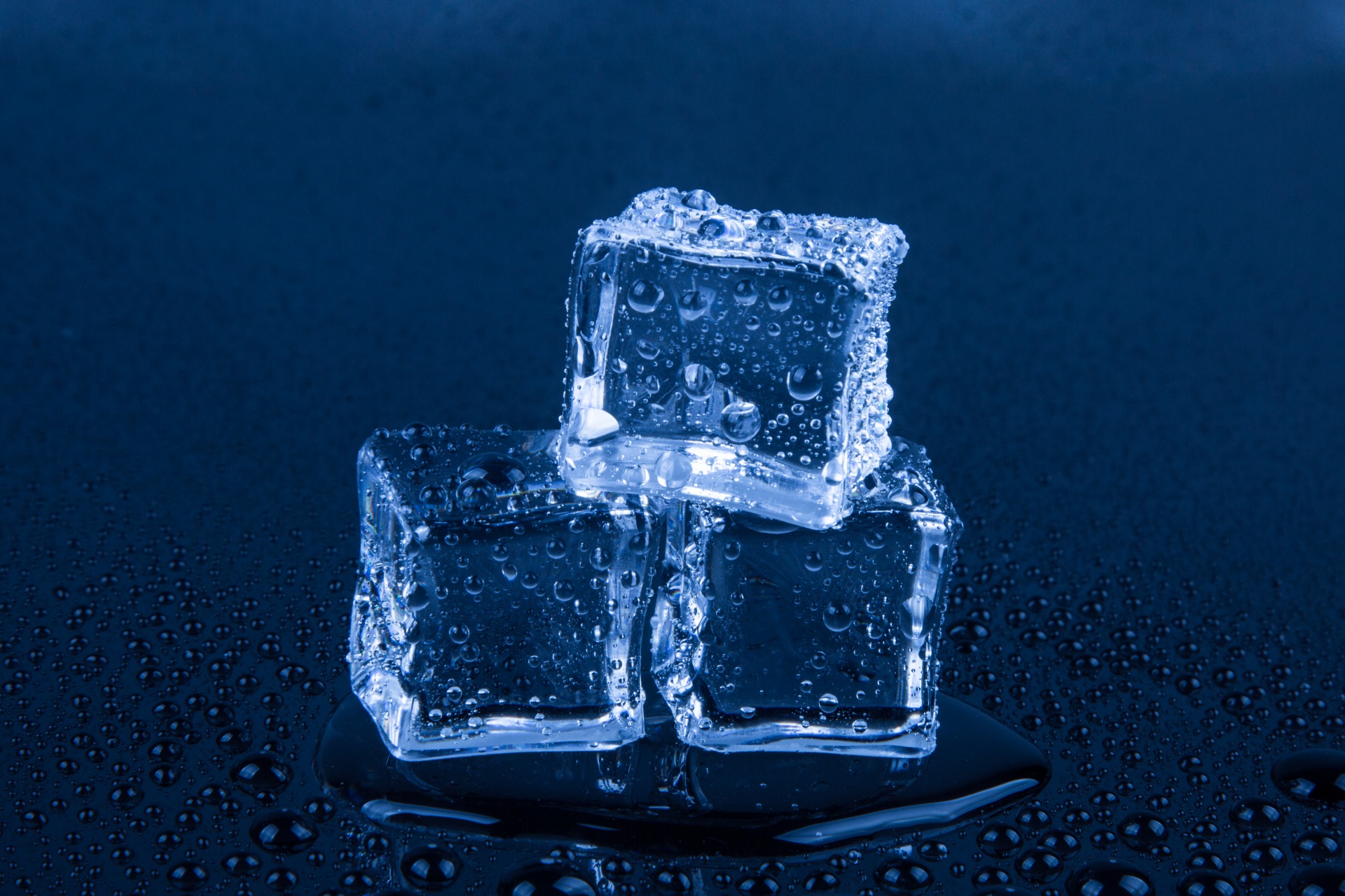 Ice Cubes isolated on the blue background
