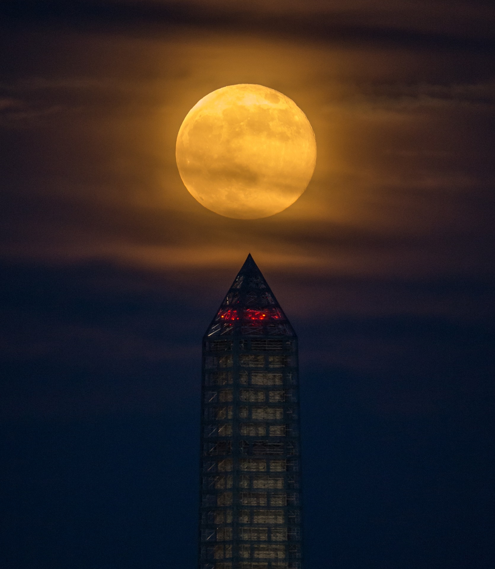 Supermoon rises behind the Washington Monument in Washington, DC