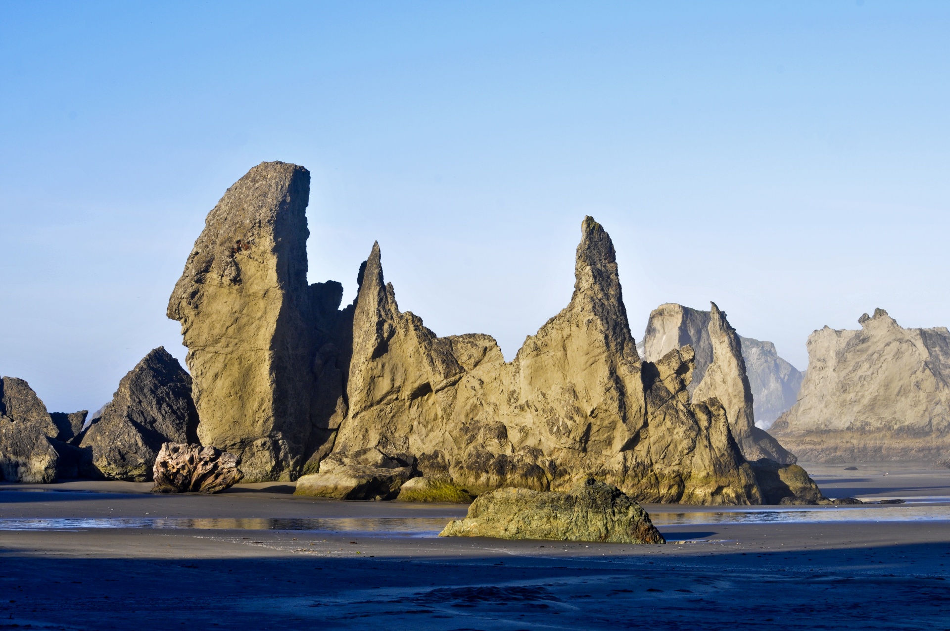 assortment of massive rocks along the shore in Brandon, Oregon