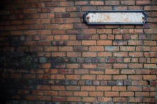 Brick Wall With Blank Sign