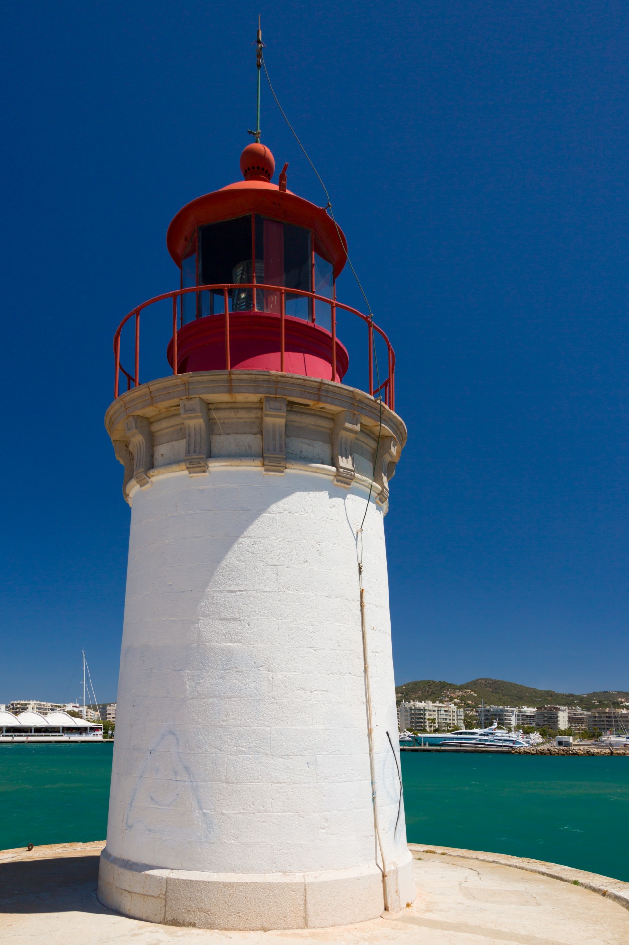 Red and white Ibiza town lighthouse