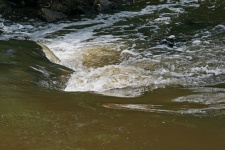 Fluid Water Breaking Over Rocks