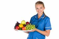Nurse And A Bowl Of Fruit