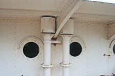 Pipes And Portholes On Old Tug