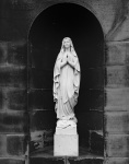 Statue Of Woman With Crucifix
