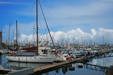 Yachts With Cloud & City Background