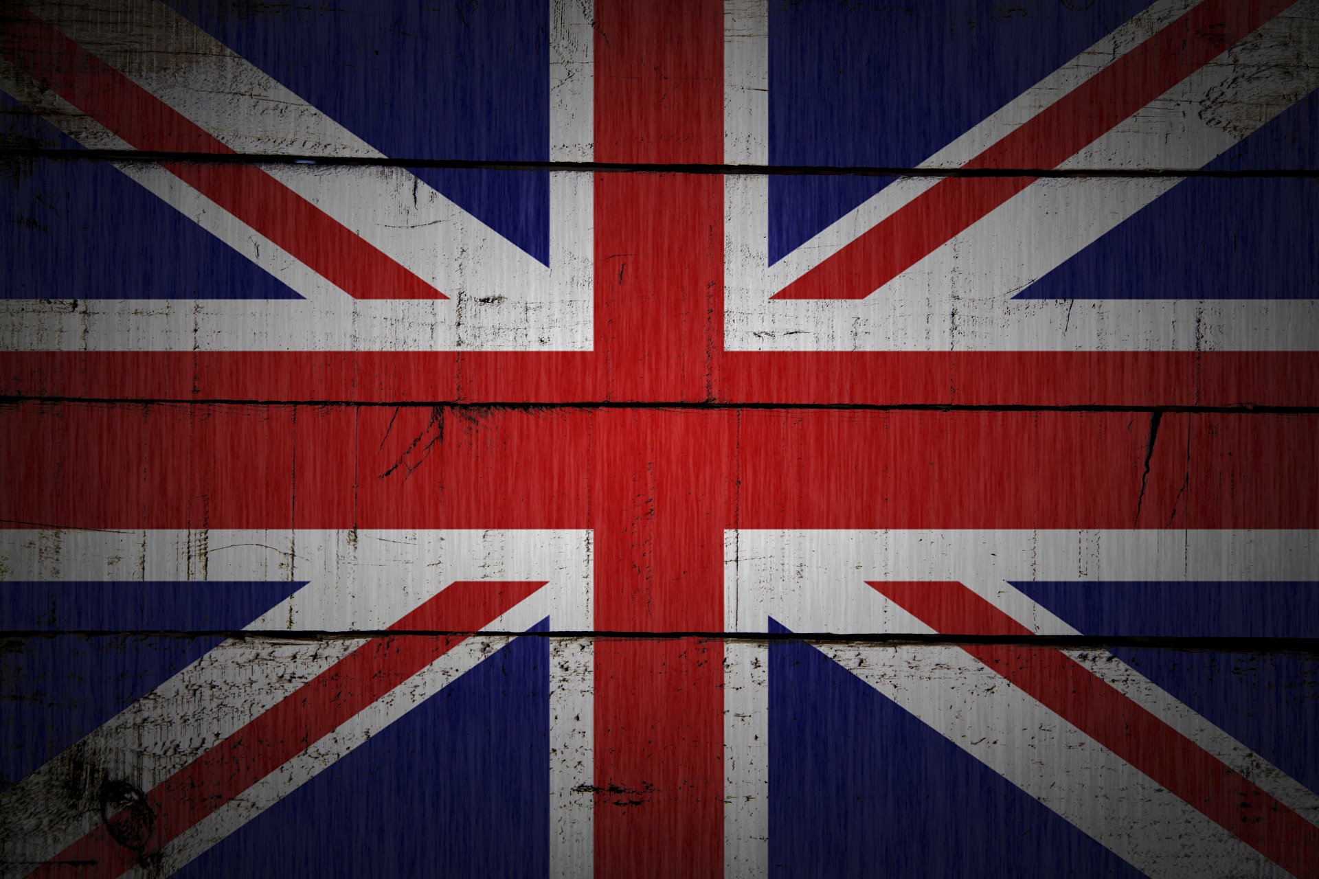 United Kingdom flag painted on old wood plank background