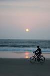 Man On The Bicycle On The Beach