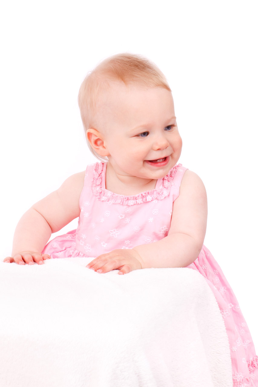 baby girl expression in pink isolated on white background