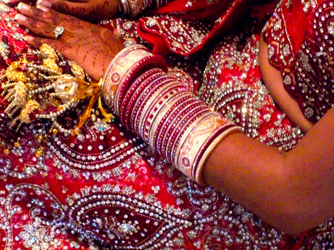An Indian bride, closeup on her gown and jewelry