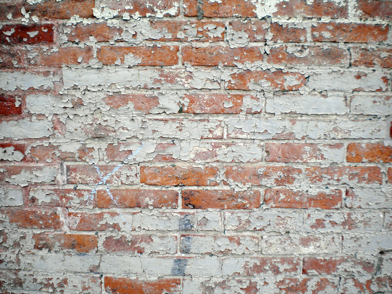 Background of brick wall texture with old, peeling paint