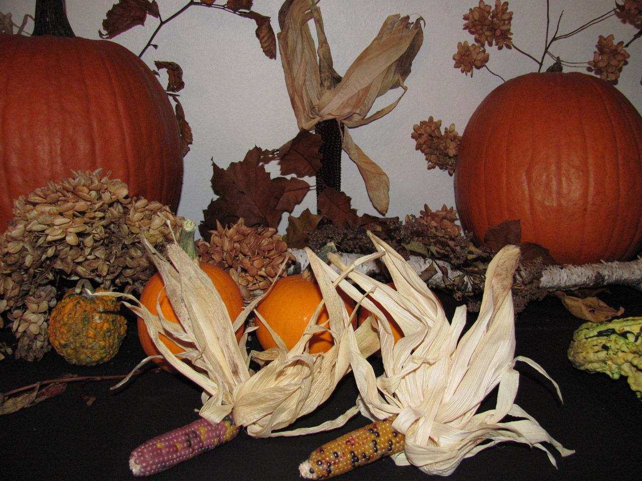 Fall arrangement with pumpkins and indian corn