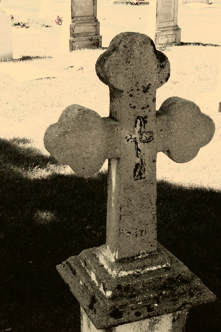 gravestone cross in cemetary