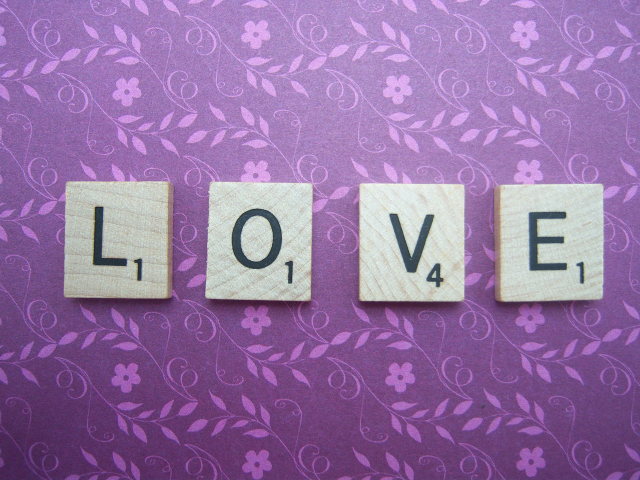 Scrabble Tiles are used to spell LOVE.