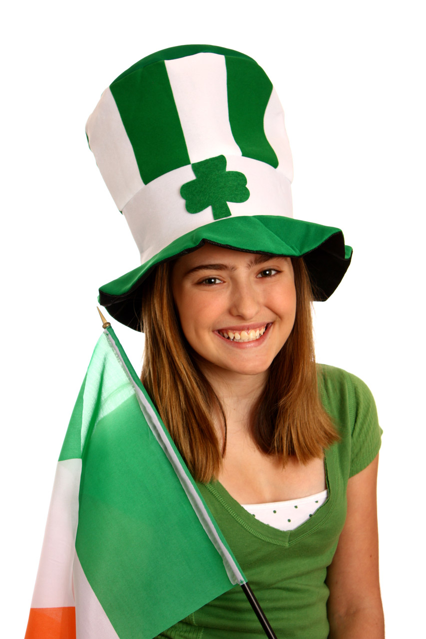 A cute young girl dressed up for Saint Patrick's Day with an Irish flag