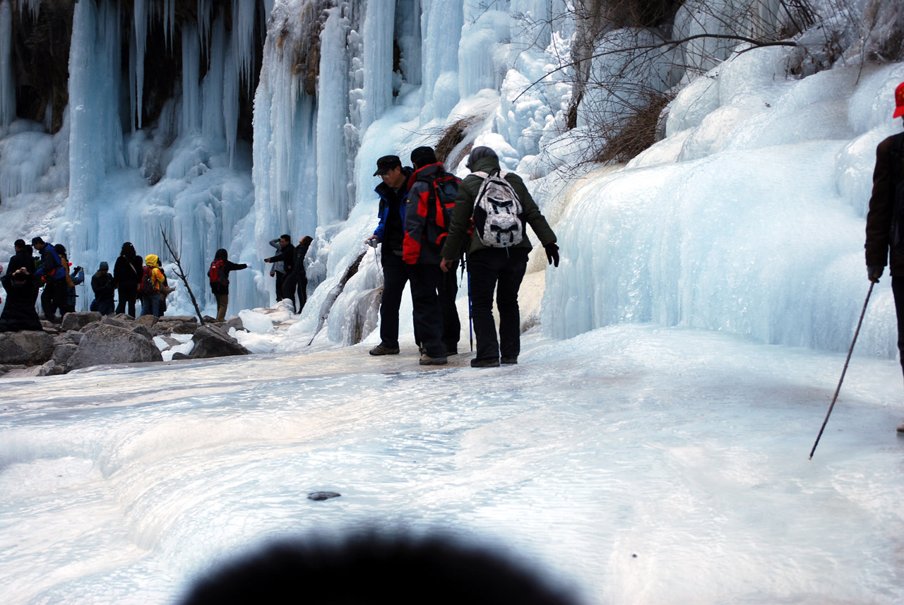 hikers go slow over a sheet of ice