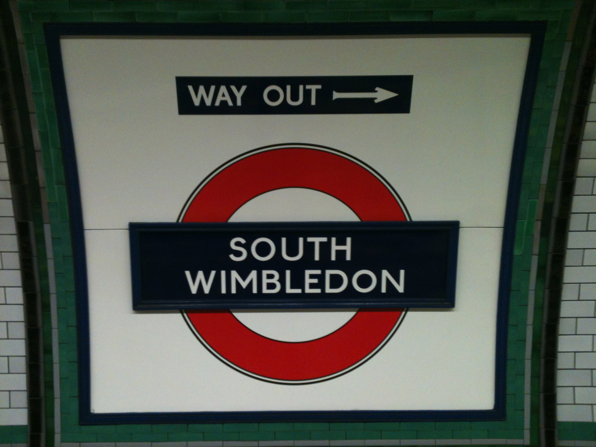 London underground sign on the platform at South Wimbledon station