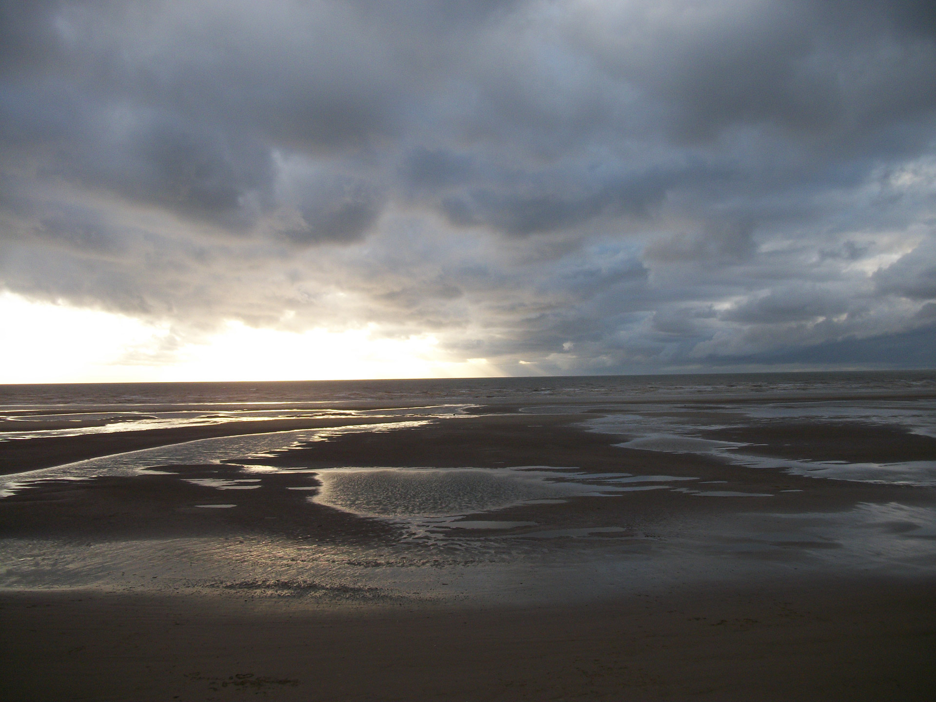 Blackpool beach early in the morning thunder clouds rolling in