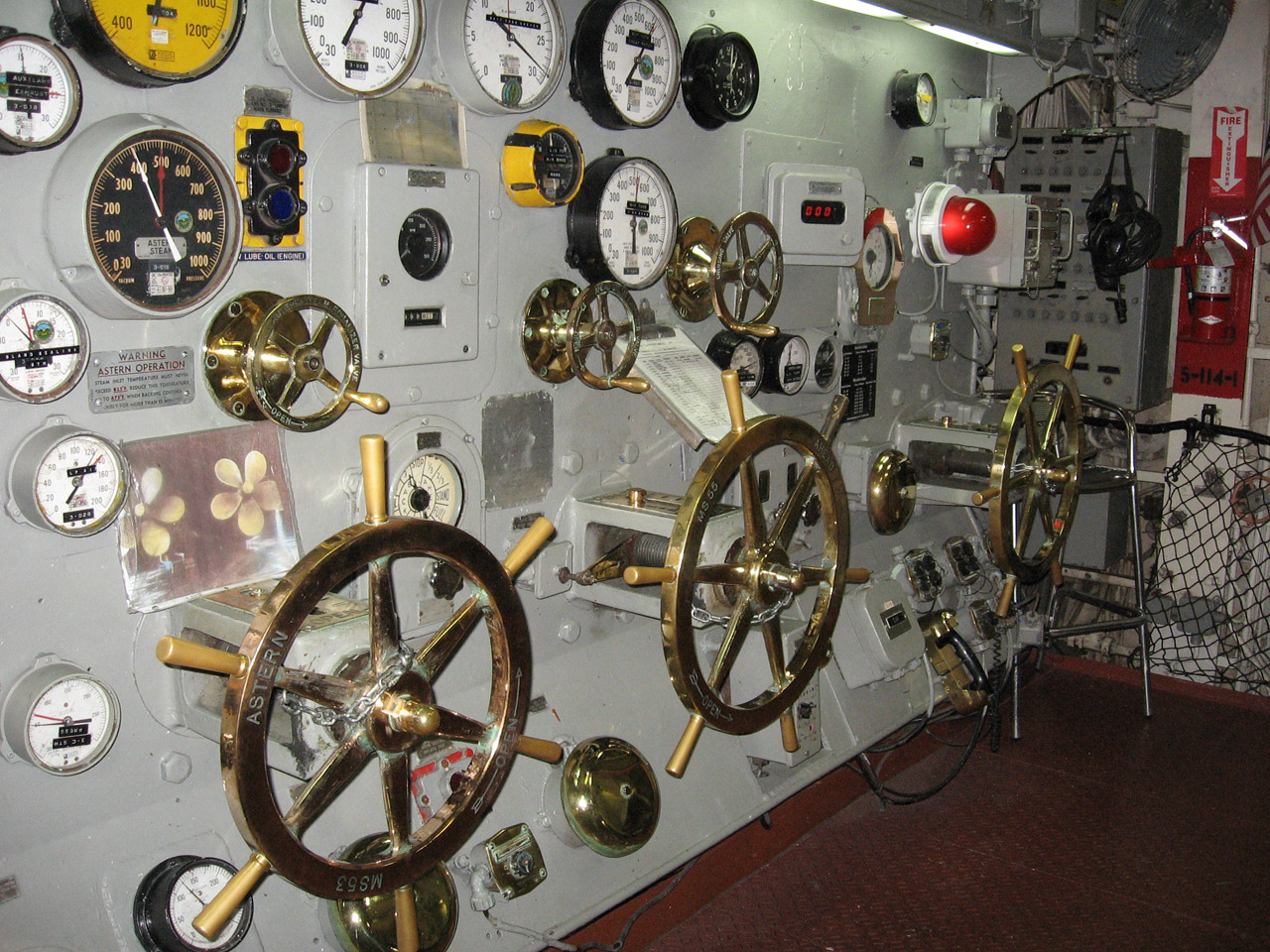 Each "wheel" represents one of the three steam boilers used for power; three men per "wheel station" manned this area 24 hours per day while the ship was moving.