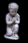 Statue Of Praying Boy