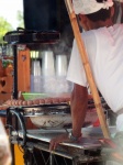 Street Vendor Cooking Sausages