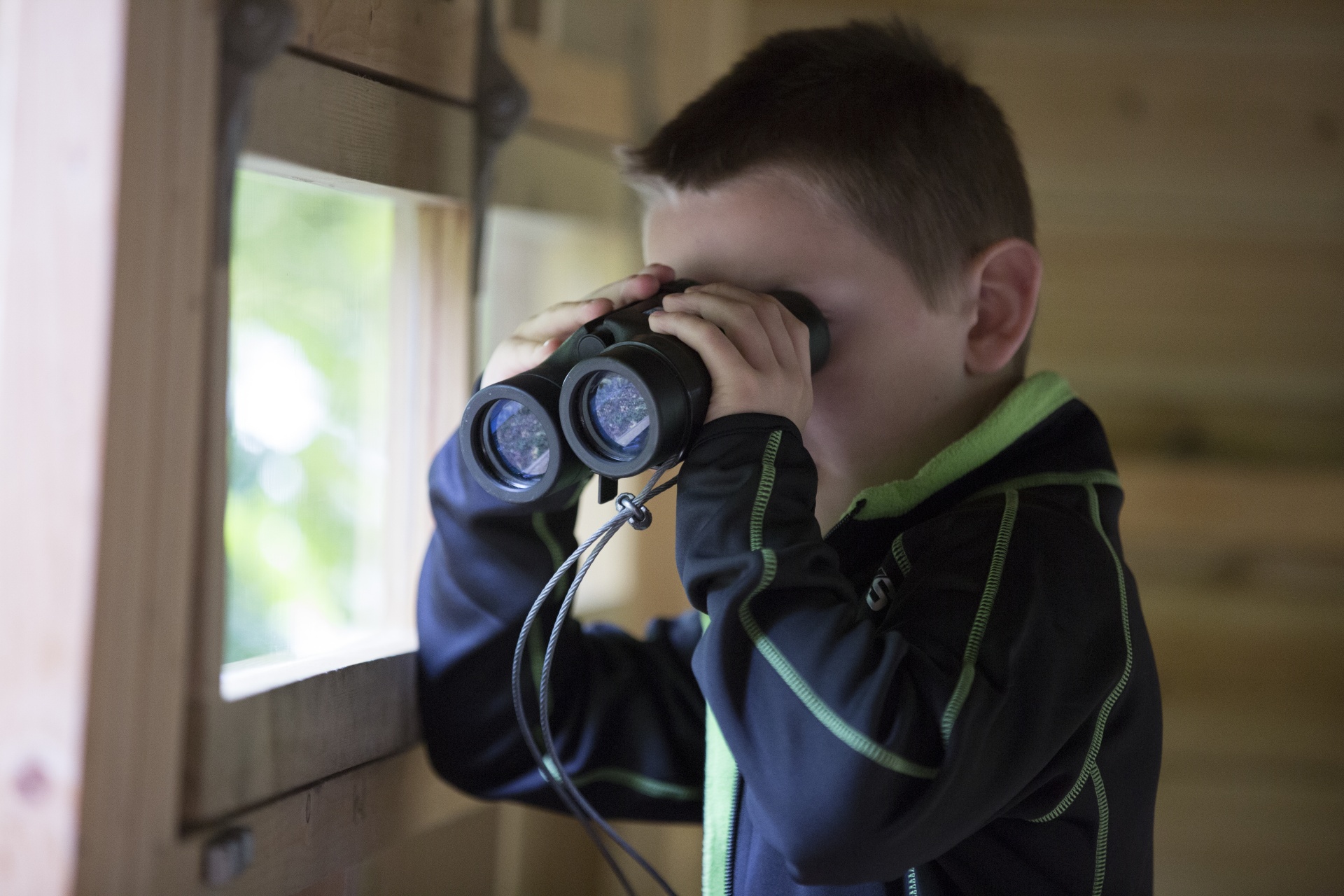 Boy Looks Through Binoculars
