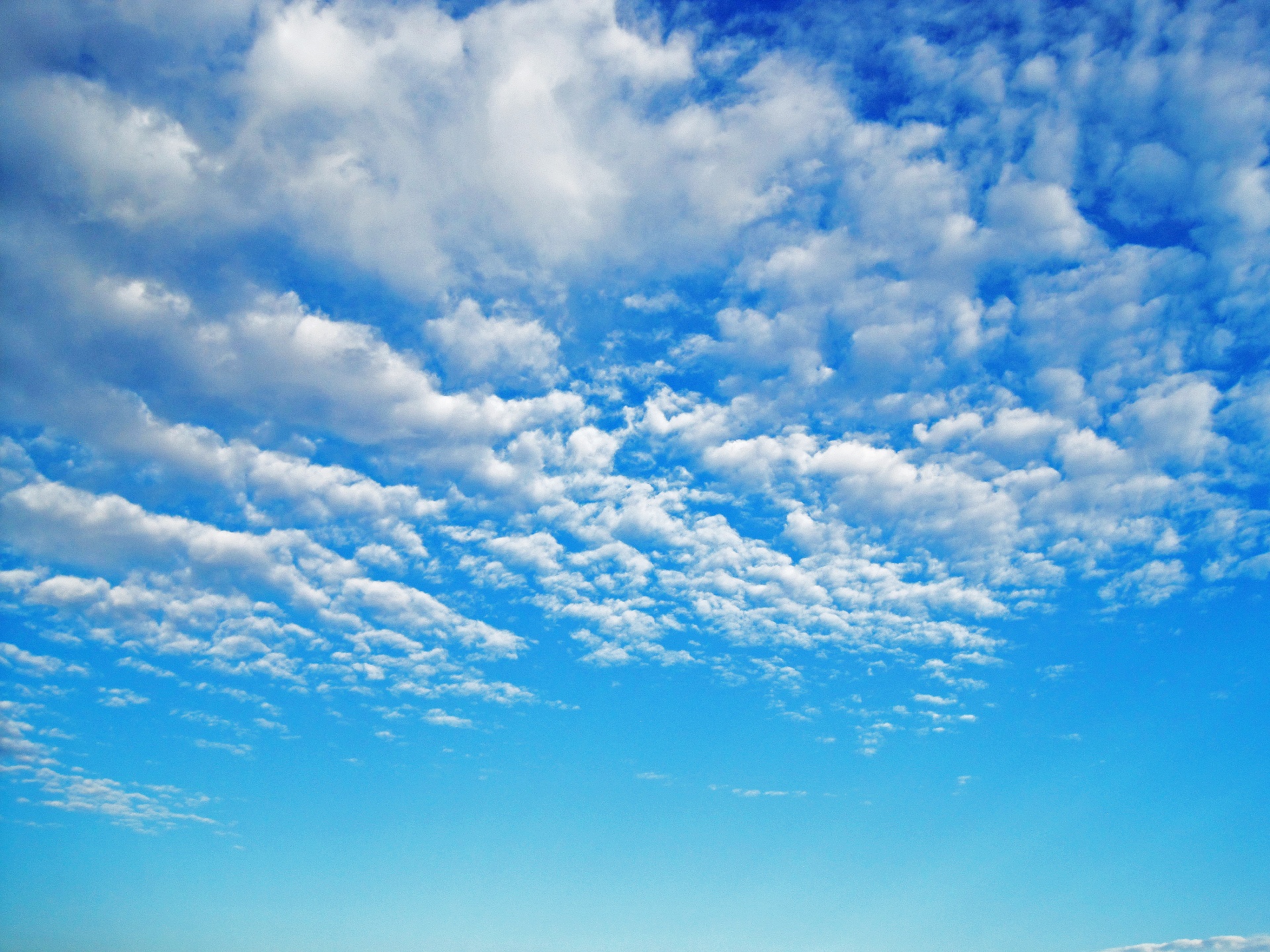 Bright Blue Sky With White Clouds