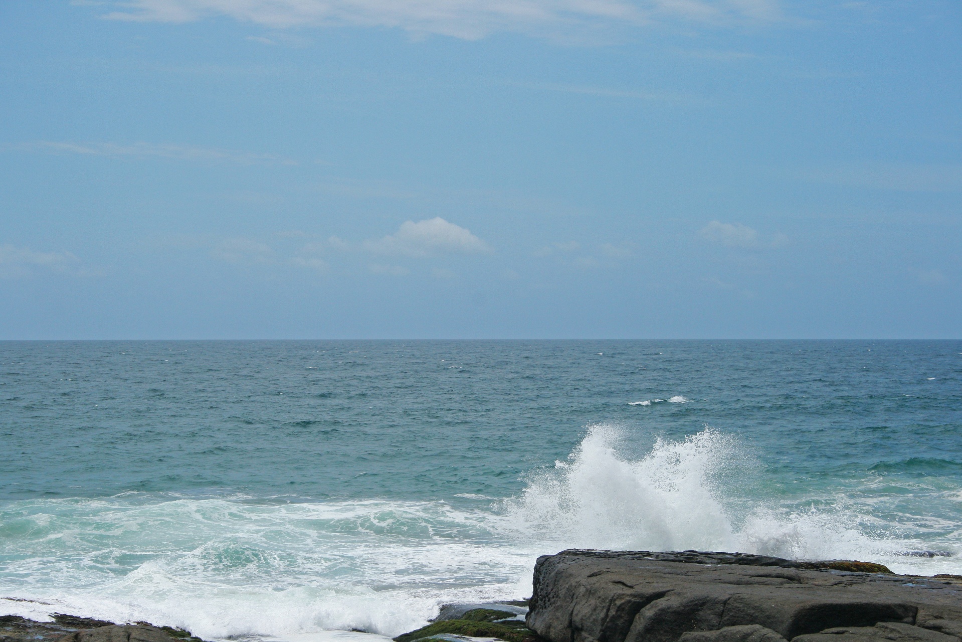 sea water spray against rocks