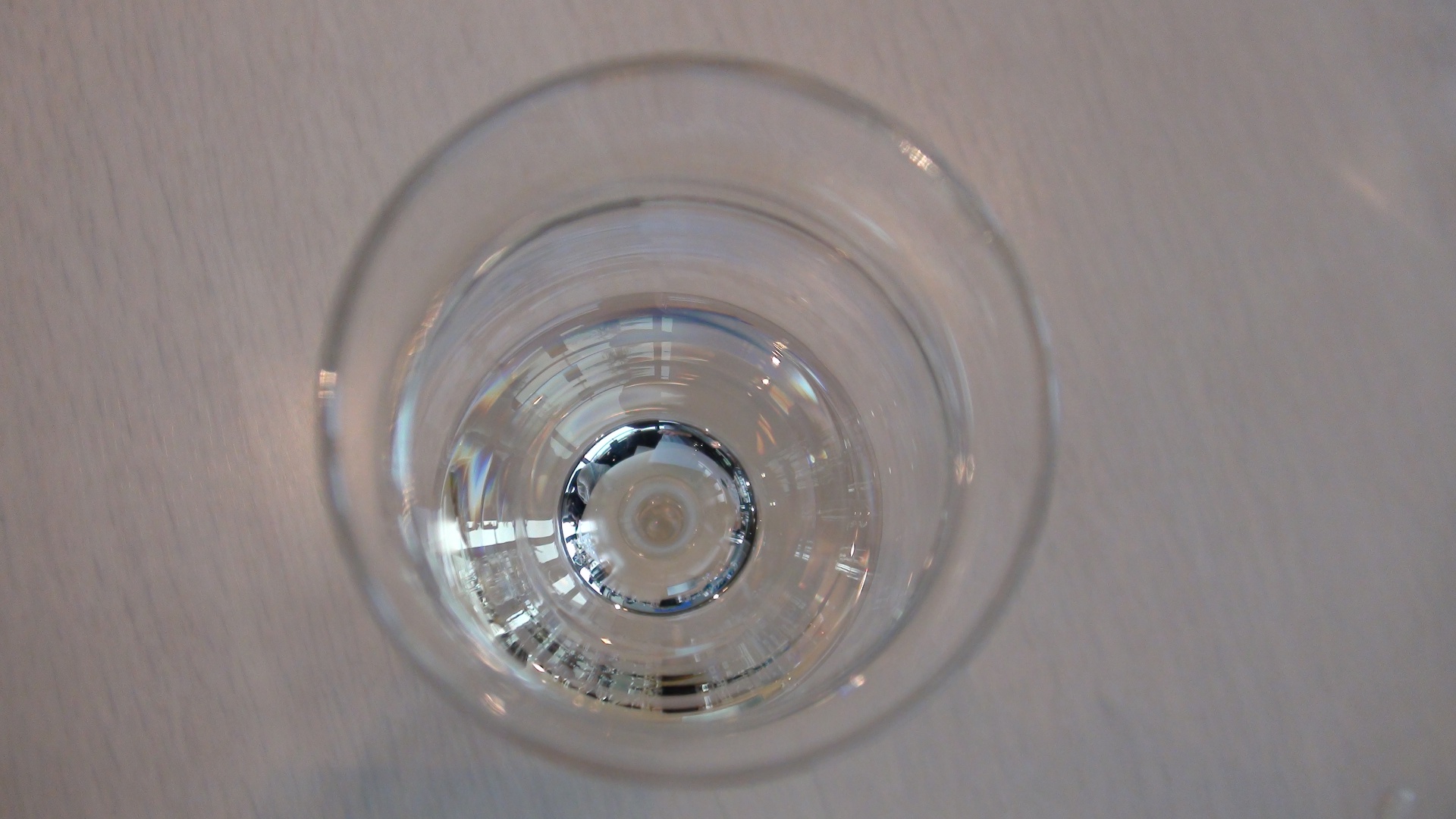 Top view of white wine in a glass.