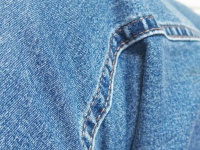 Stitching And Fold On Blue Jeans