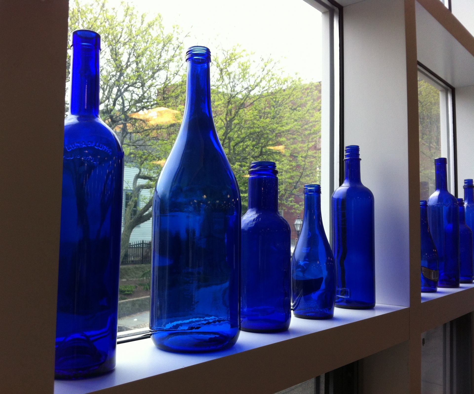 Blue bottles along the window sill