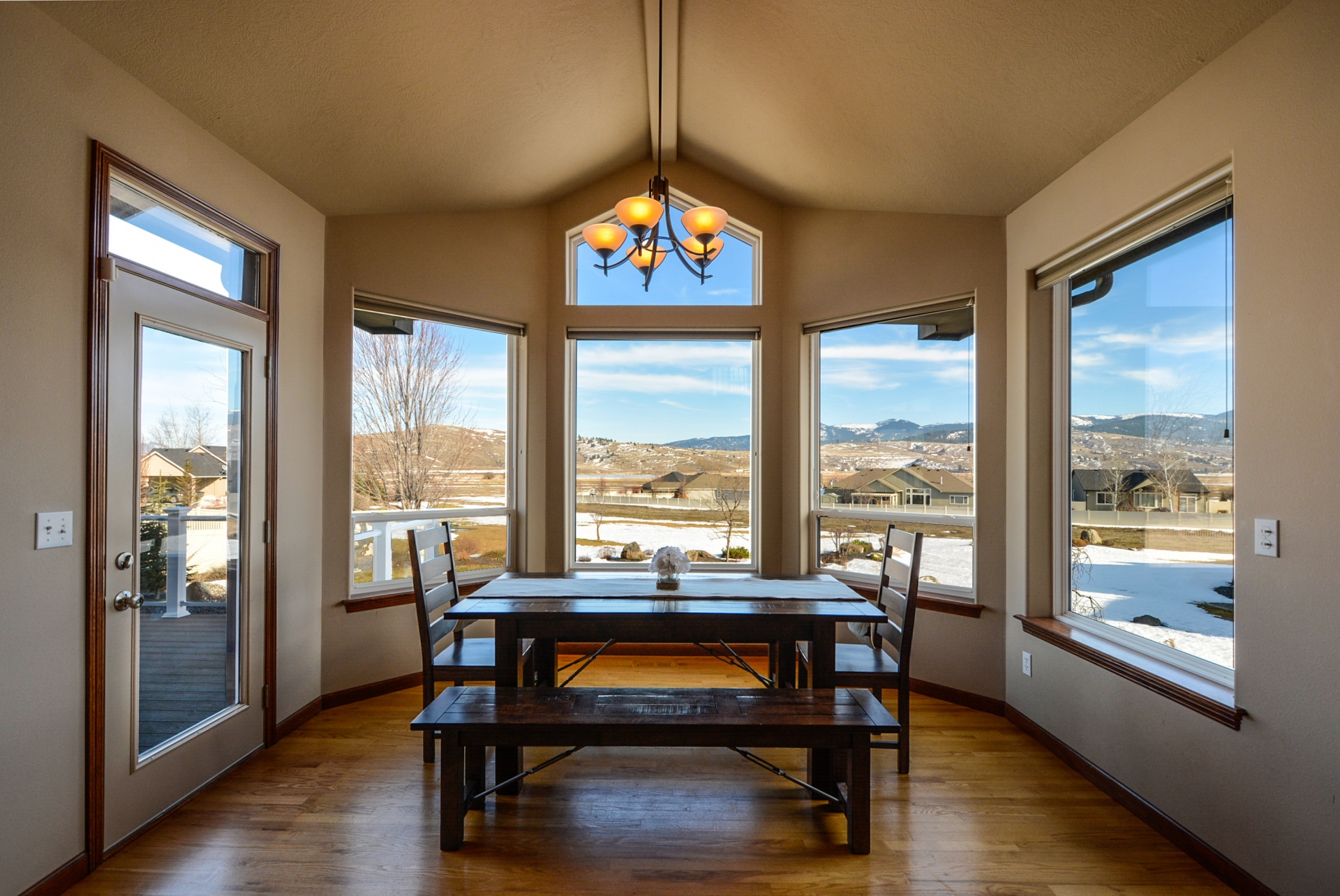 Dining room with windows looking at mountains