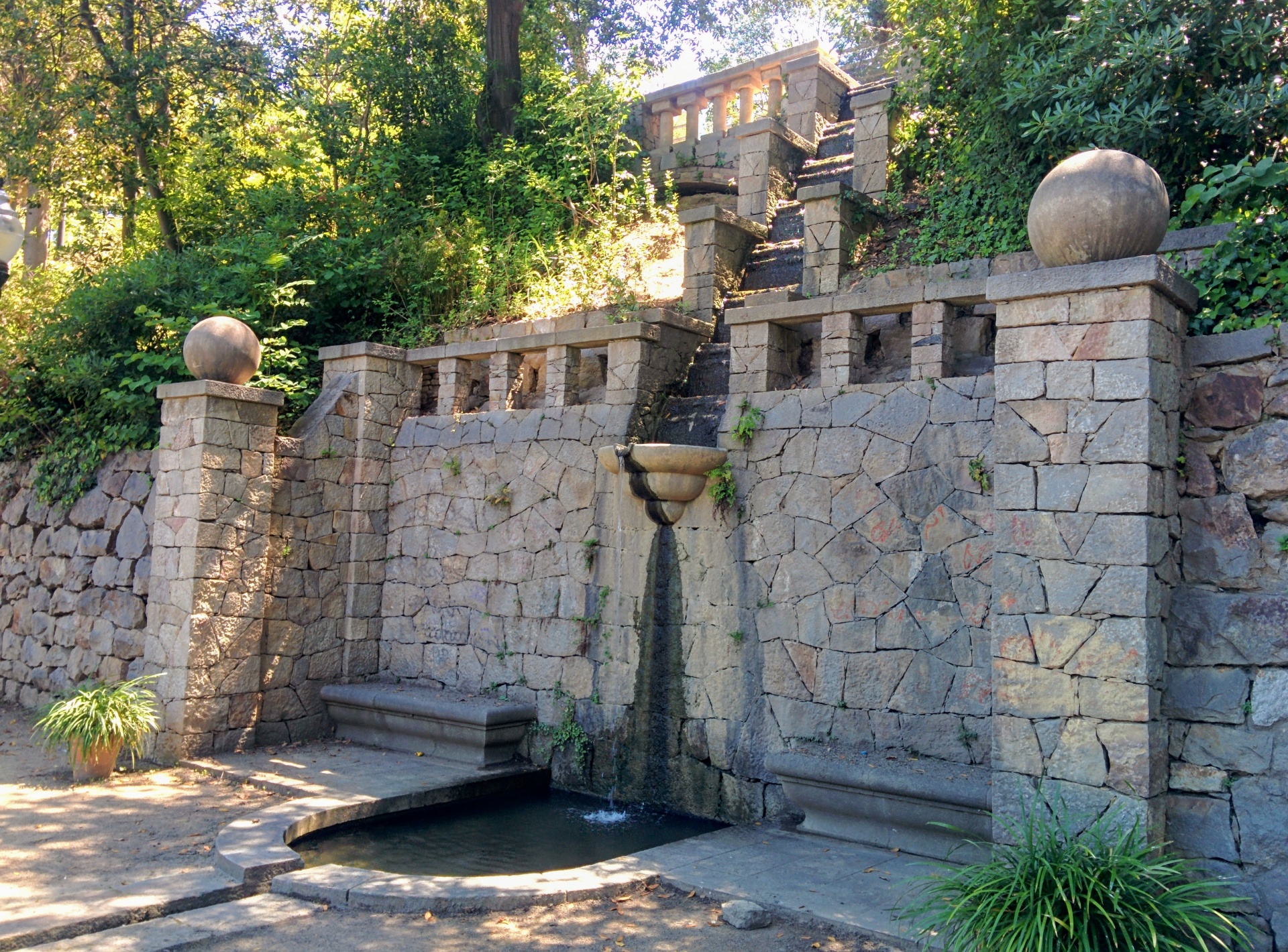 Stone fountain in the gardens of Barcelona Laribal