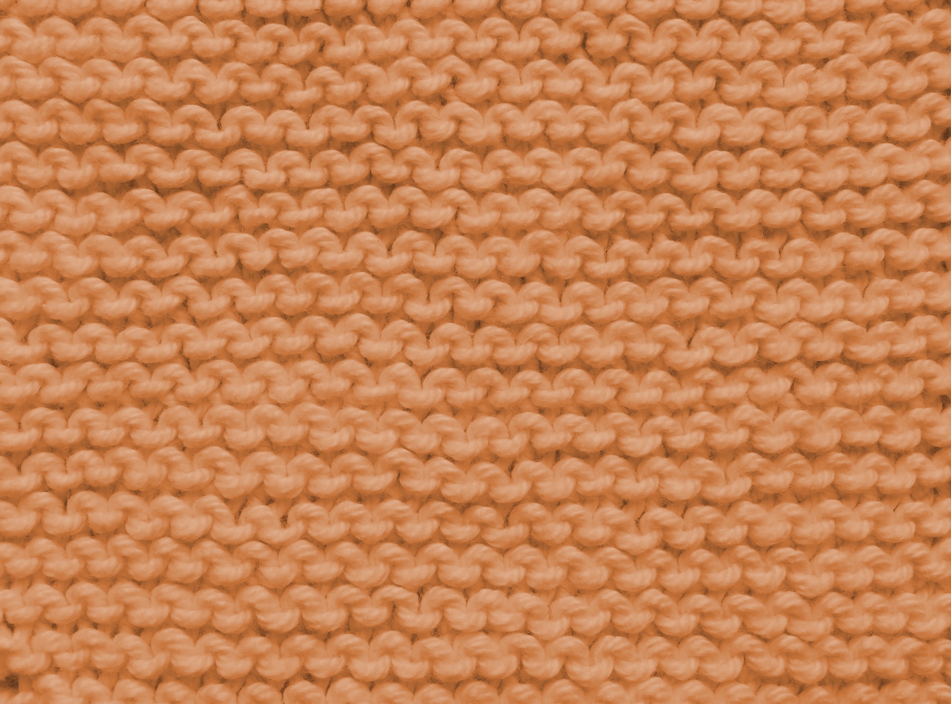 Plain knit stitch in orange background