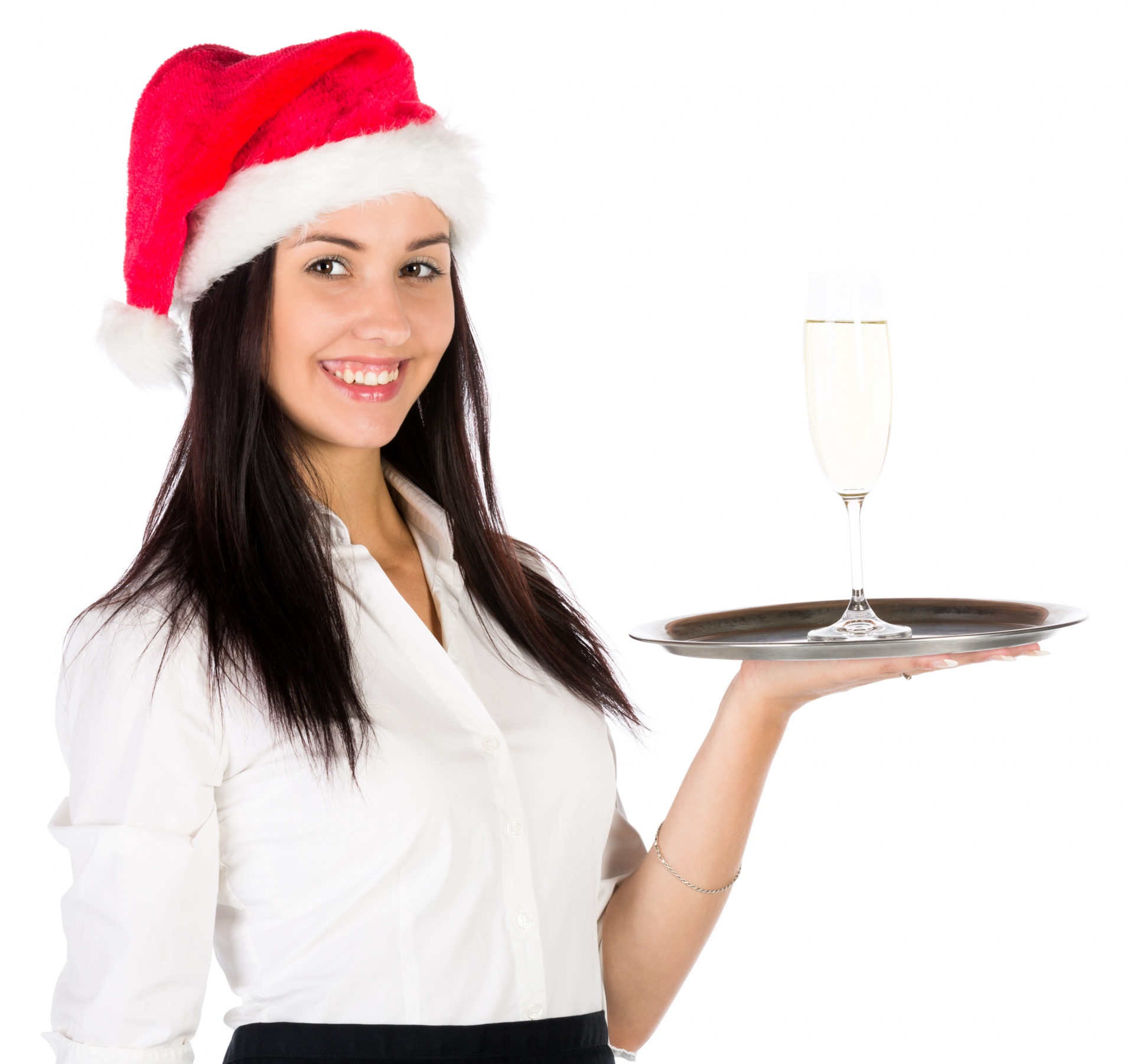 Young woman in Santa's hat holding a tray with a glass of champagne