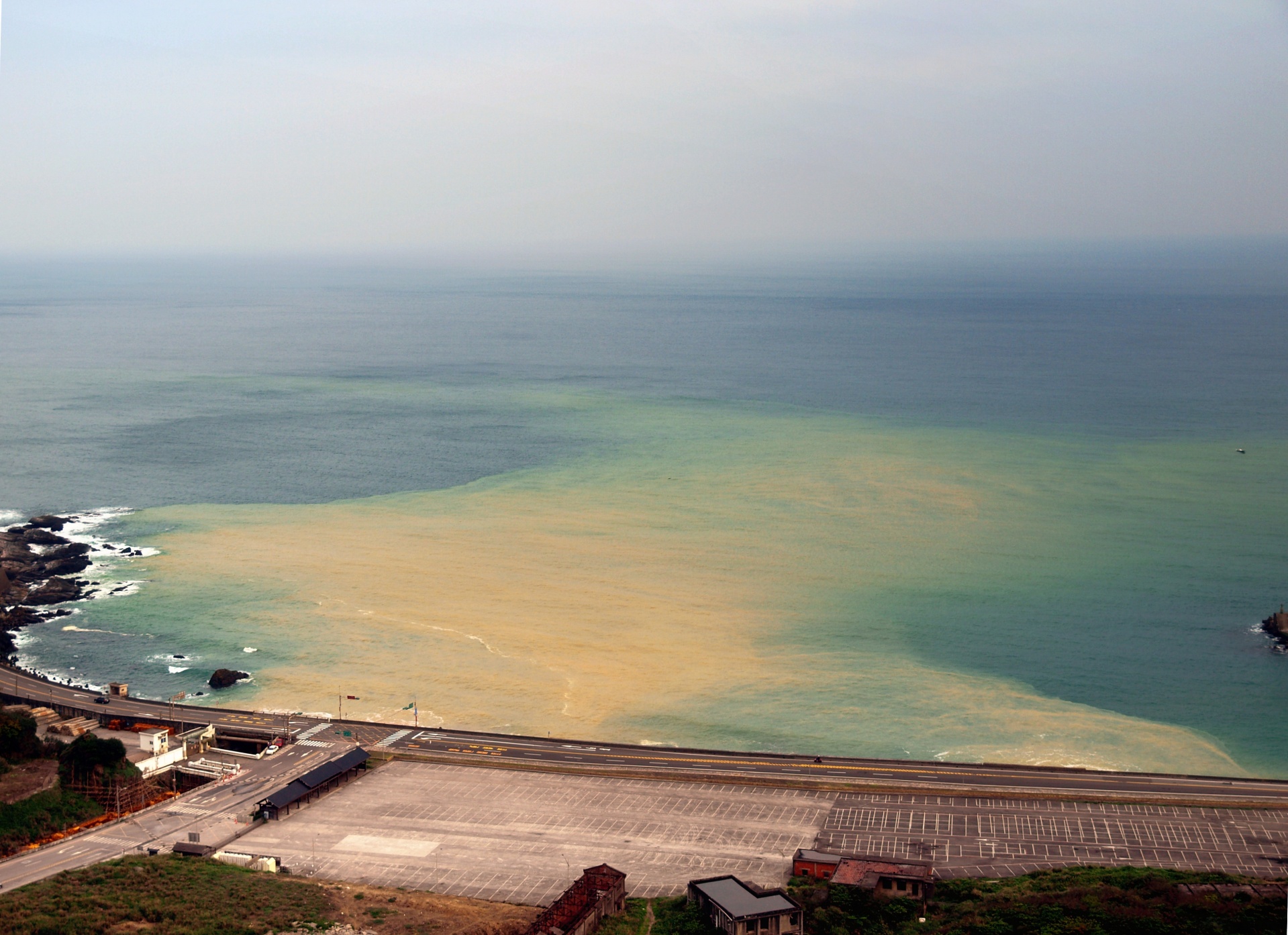Aerial view of the Yin-yang Sea, an area of seawater coloured by waste from gold mines, Ruifang, Taiwan