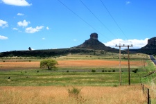 Landscape With Butte In Background