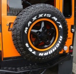 Orange Land Rover Jeep Spare Wheel