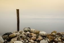 Rocks And Wooden Pole