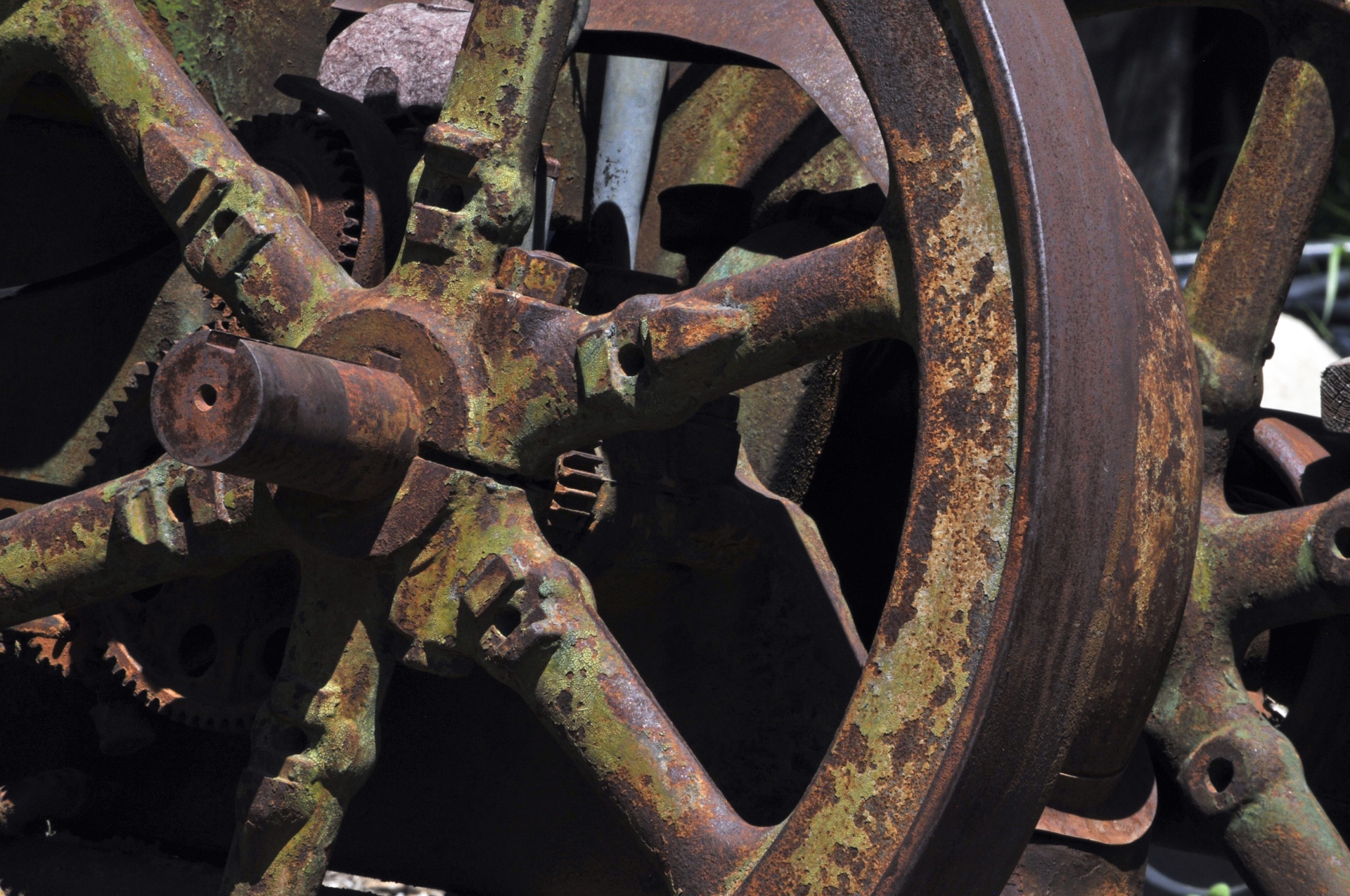 close up of wheel of an old piece of farming equipment